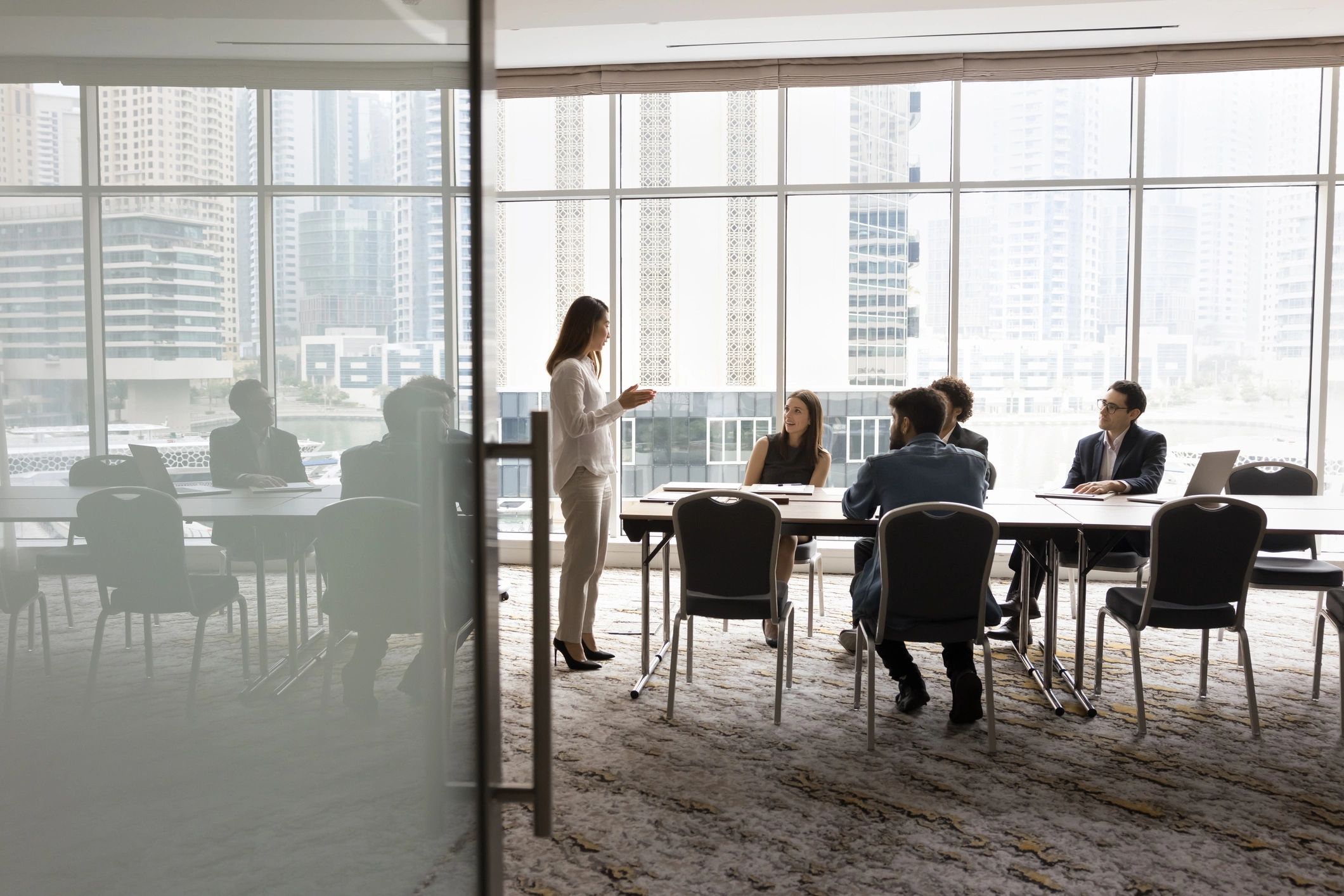 Creative editorial team in a conference room discussing story ideas