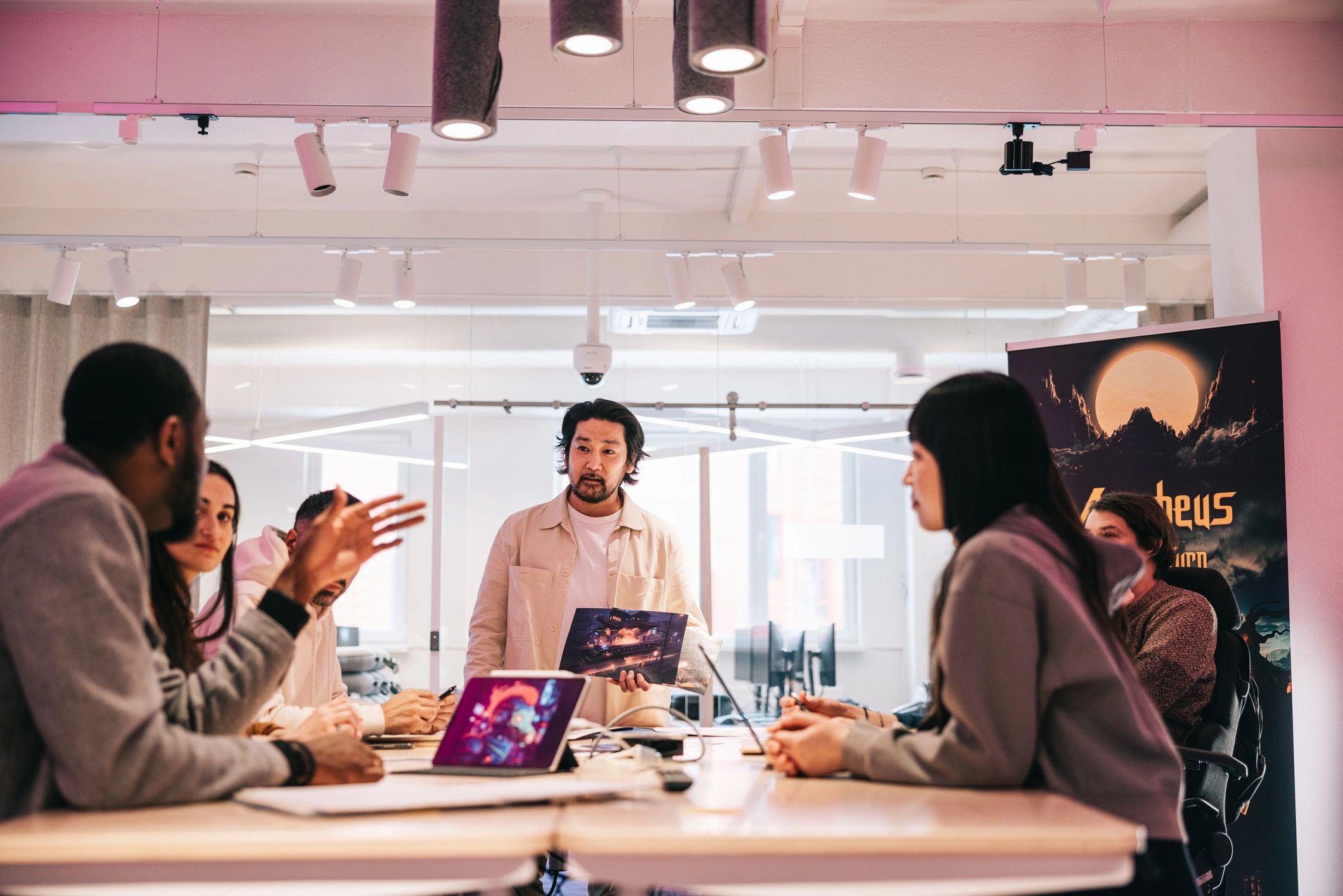 Creative team collaborating around a conference table
