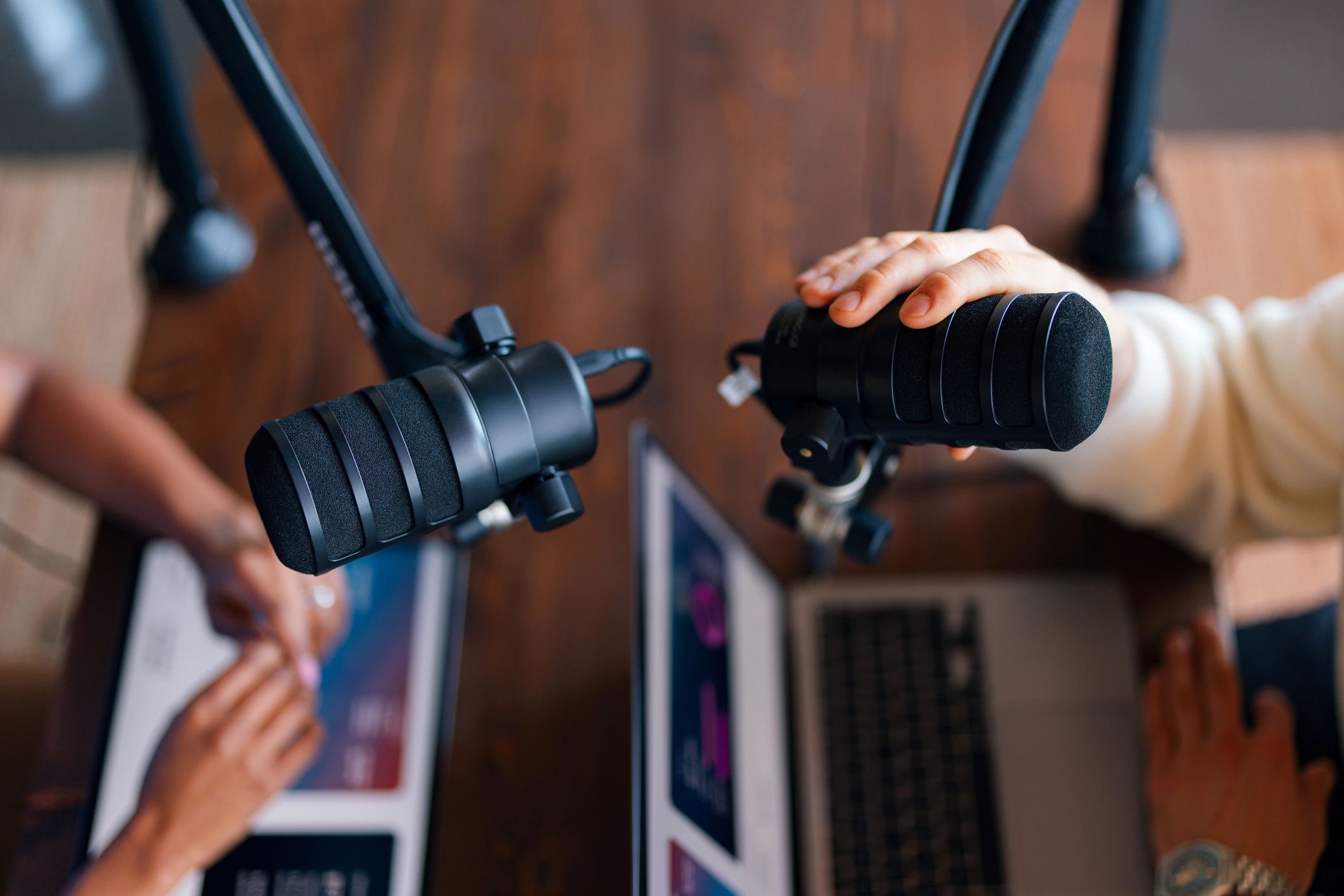 Podcast hosts recording a music interview in studio